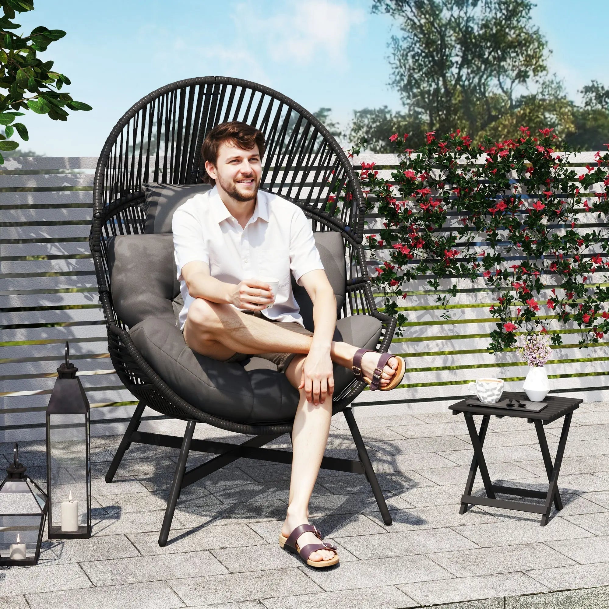 Outsunny standing black rattan egg chair with gray cushioned seat, powder-coated steel frame for outdoor use
