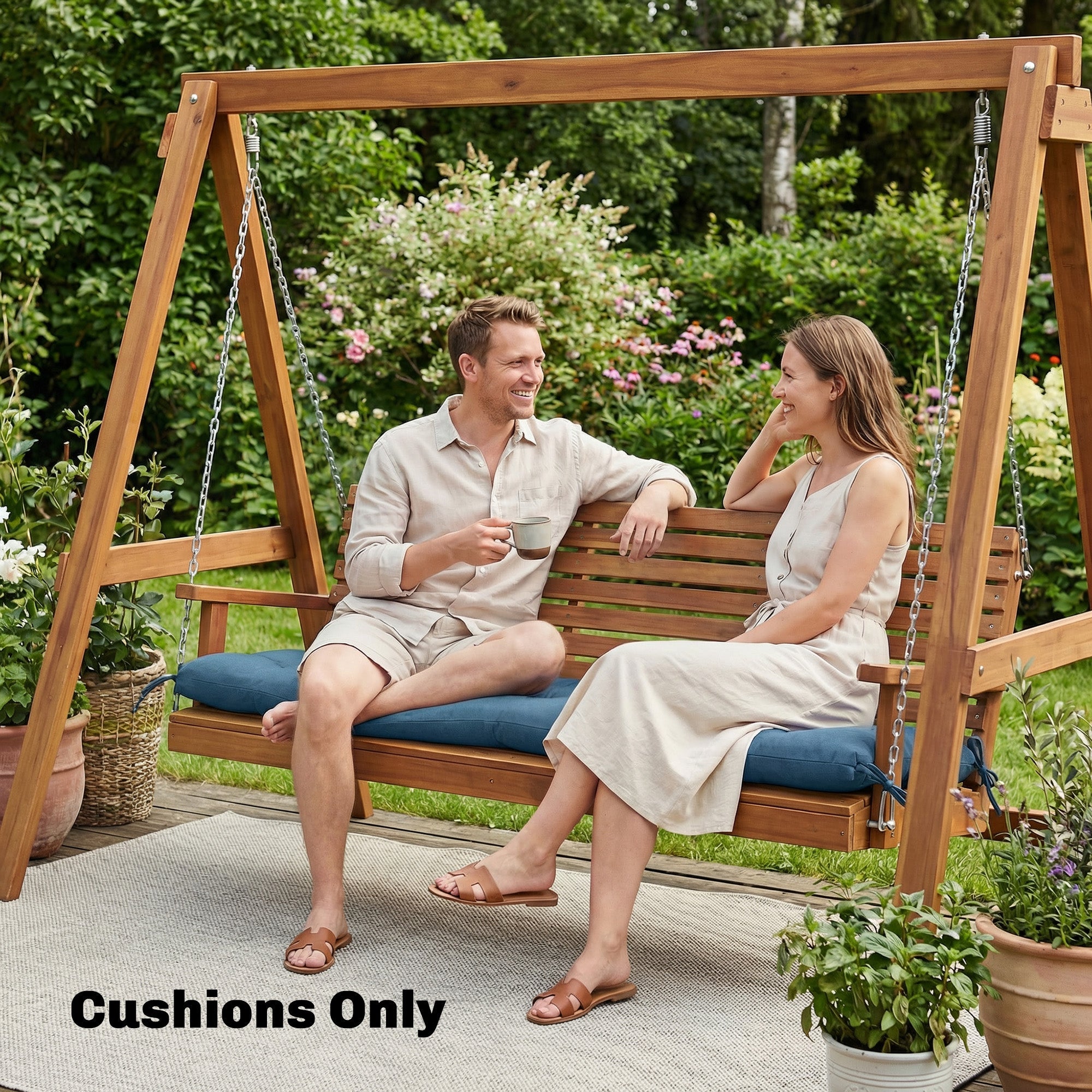 Wooden swing with blue outsunny memory foam sun lounger cushion tied securely for outdoor use