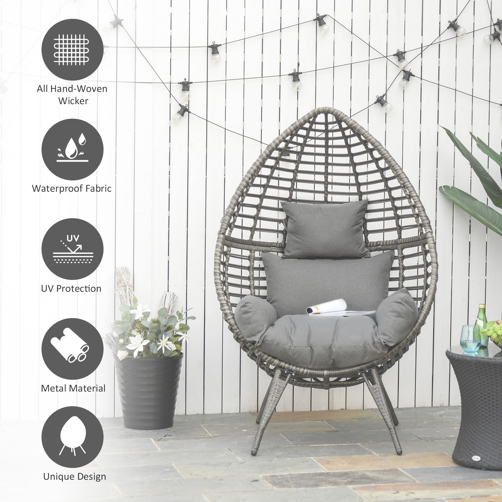 Dark gray hand-woven wicker lazy chair with thick cushions and metal legs perfect for outdoor garden seating