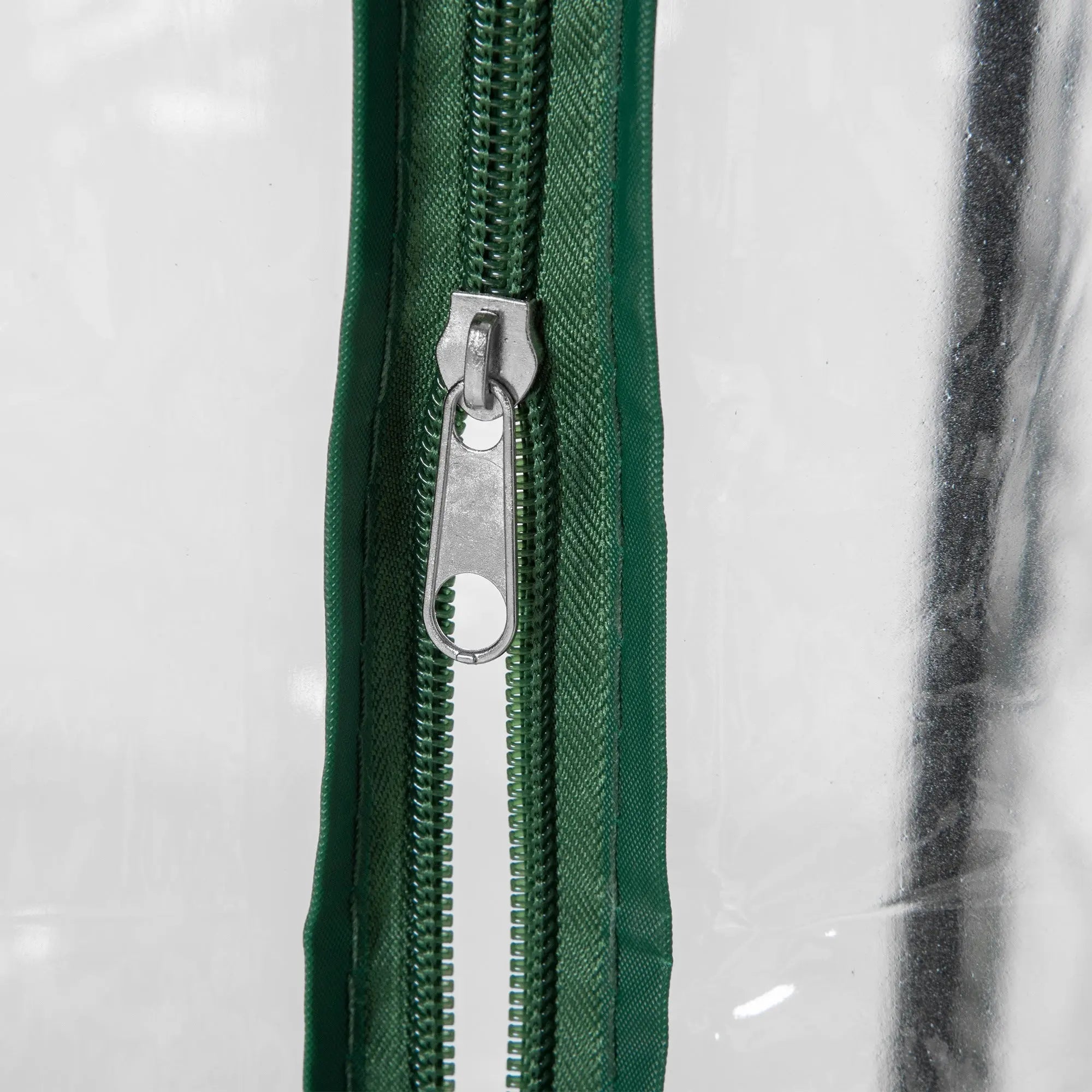 Green zipper with silver metal pull tab on outsunny mini greenhouse pvc cover for outdoor spaces