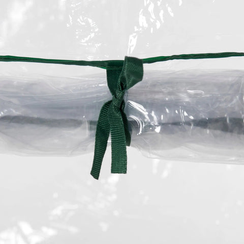 Dark green woven fabric tie securing transparent pvc cover on outsunny mini greenhouse for outdoor spaces