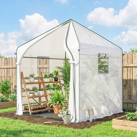 White outsunny walk-in greenhouse with transparent panels green trim reinforced steel frame and large roll-up door