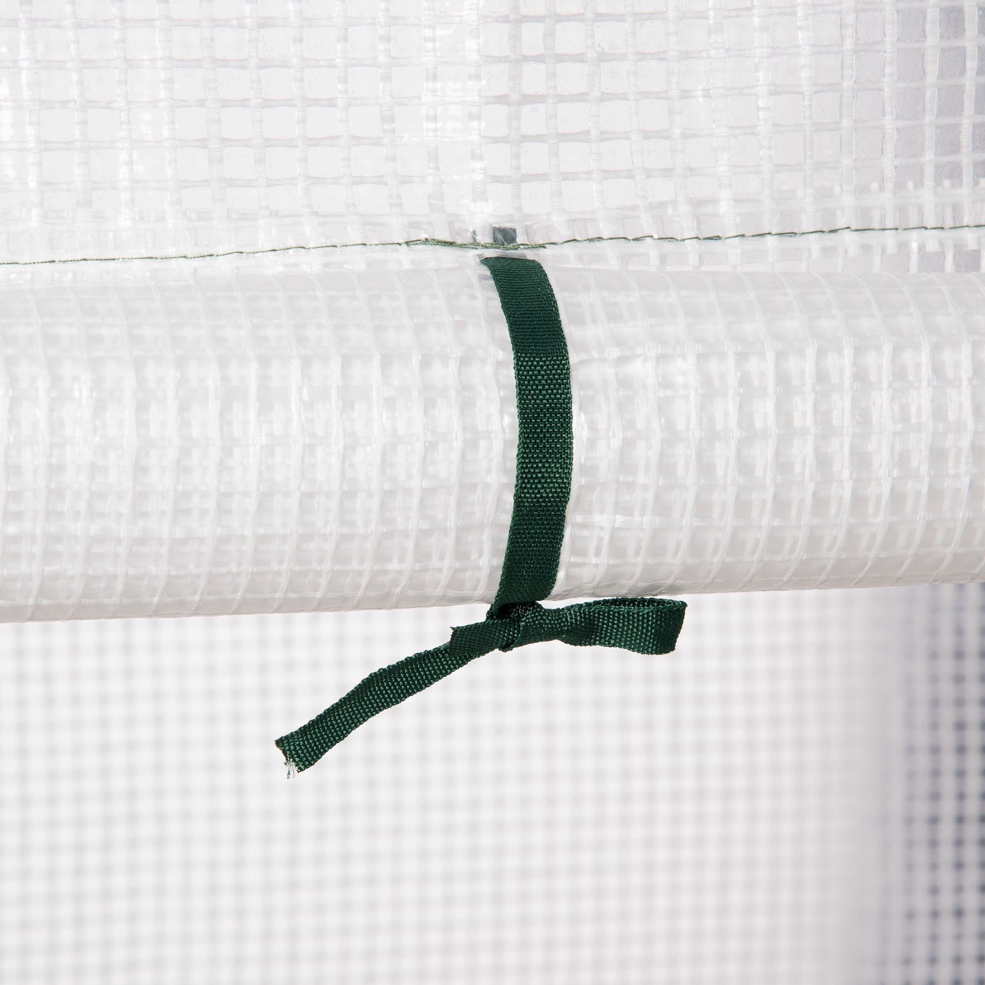 Dark green fabric tie securing white mesh panel on outsunny walk in greenhouse with roll up door and reinforced pe cover