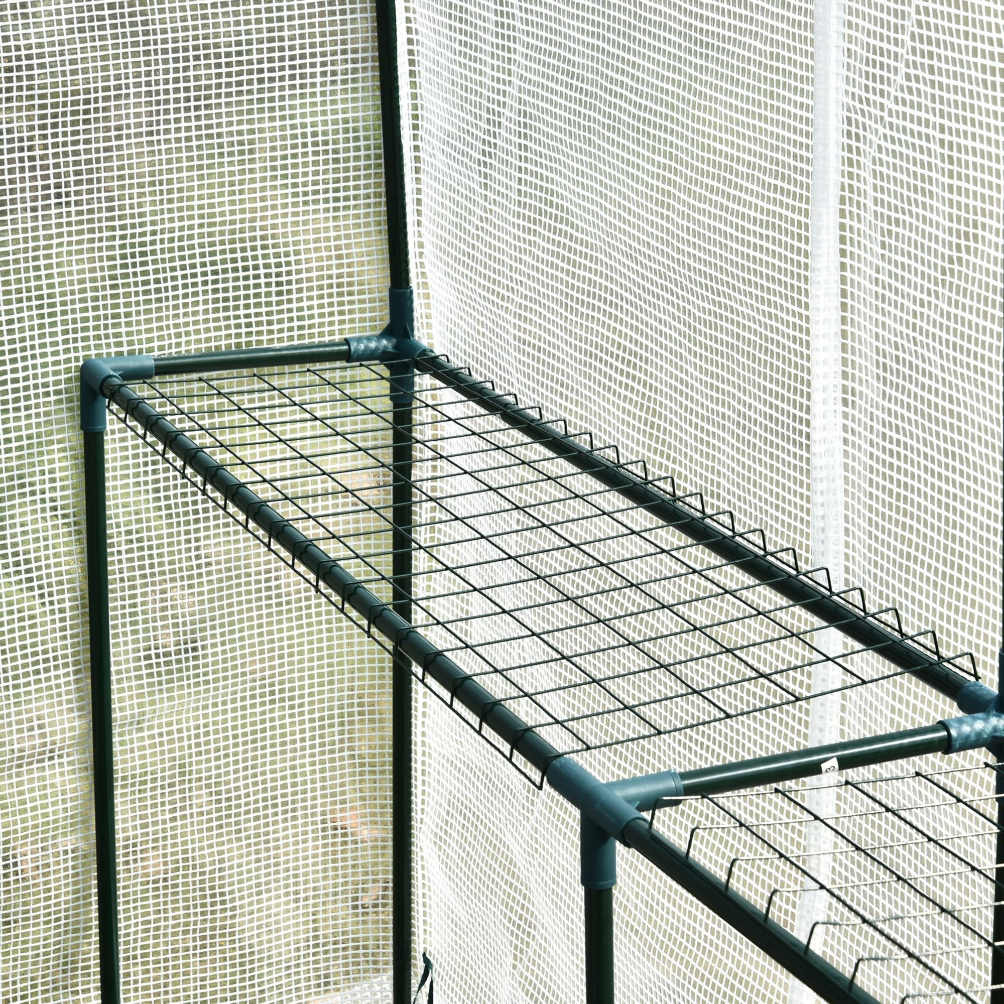 Dark green metal wire shelf with steel frame and tough core in outsunny walk in greenhouse with plastic cover