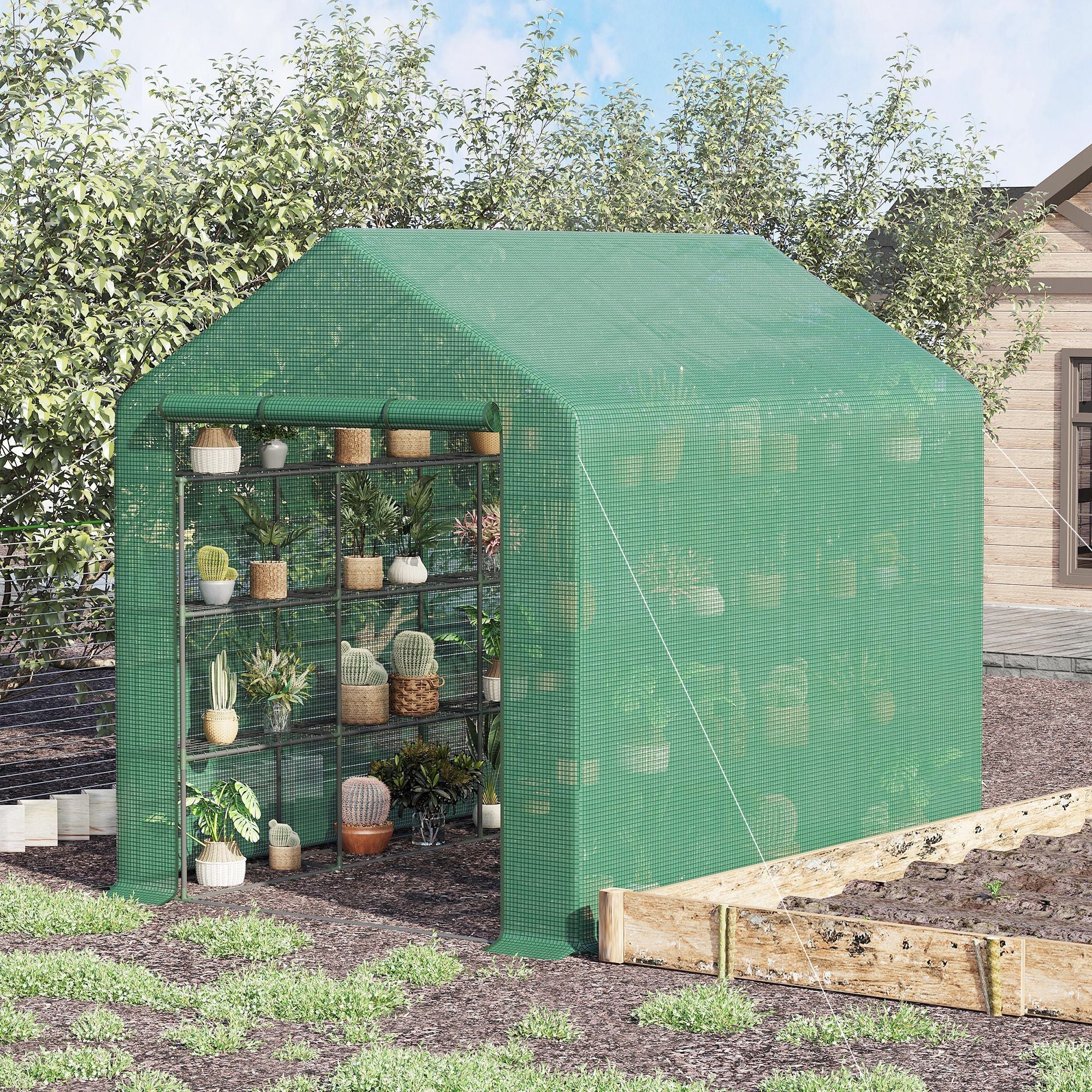 Outsunny walk-in greenhouse in green with powder coated steel frame and shelves holding potted plants inside