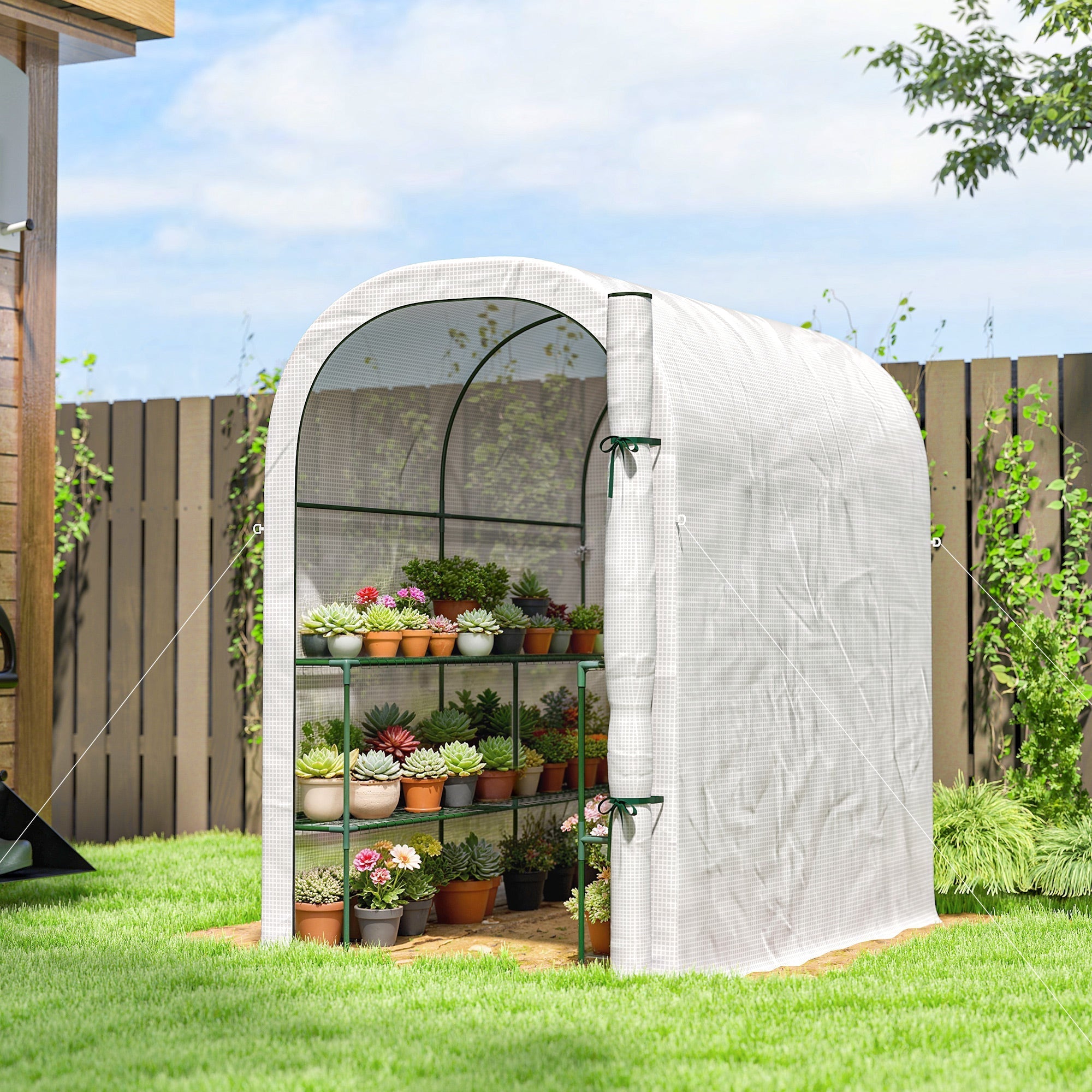 Outsunny walk-in greenhouse with white pe cover and green metal frame filled with flower pots and gardening tools on shelves
