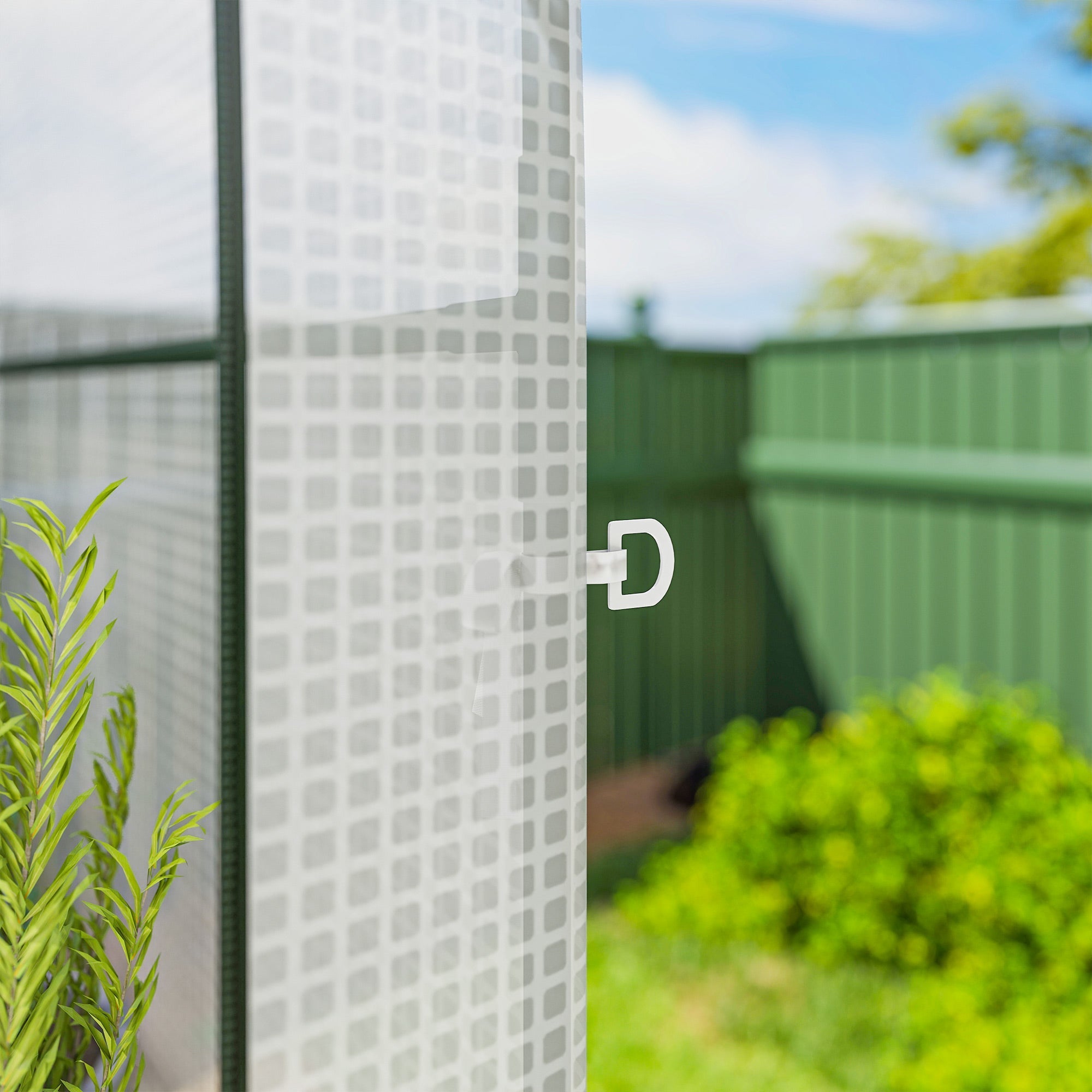 White plastic grid panel with d ring on the back of outsunny walk in greenhouse for flower pots and gardening tools