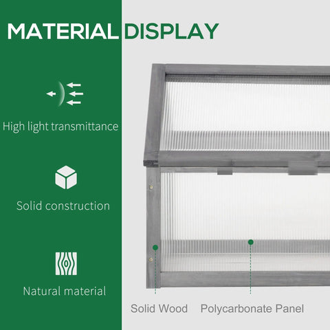 Gray framed cold frame greenhouse with translucent polycarbonate panels and solid wood frame for growing plants