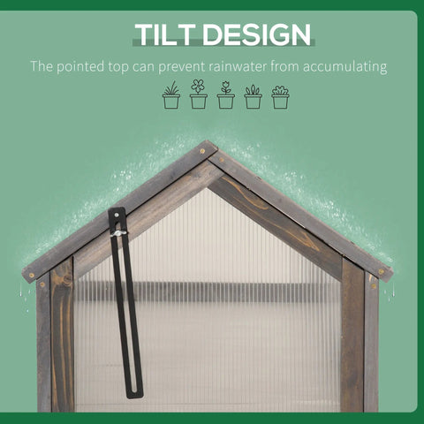 Wooden cold frame greenhouse with grey polycarbonate roof and black metal tilt mechanism for growing plants