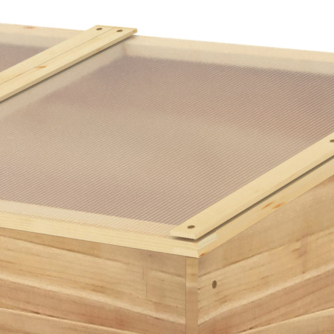 Light-colored wooden cold frame greenhouse with mesh screen lid for flowers vegetables and plants growing