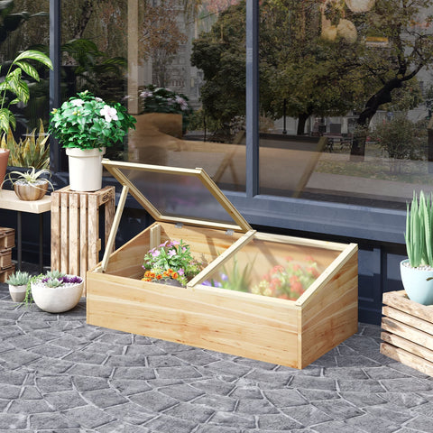 Light-colored wooden cold frame greenhouse with glass lid and independent openable top for plants and vegetables