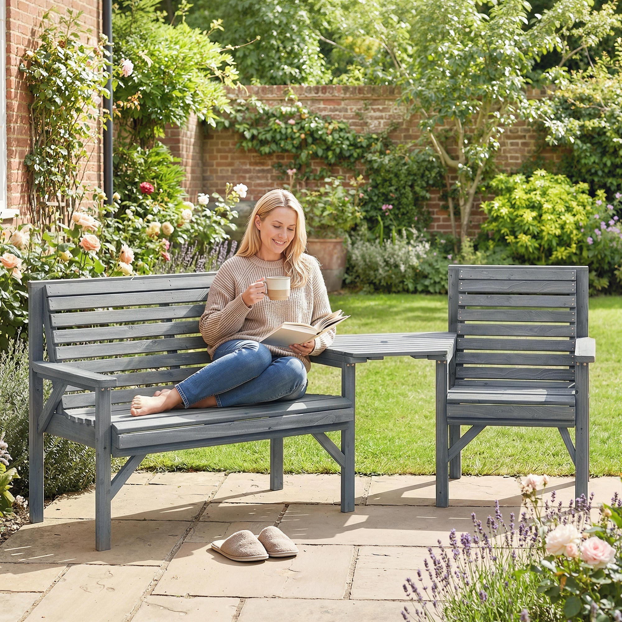 Gray wooden garden furniture set with bench, chair, and detachable tray table featuring parasol hole