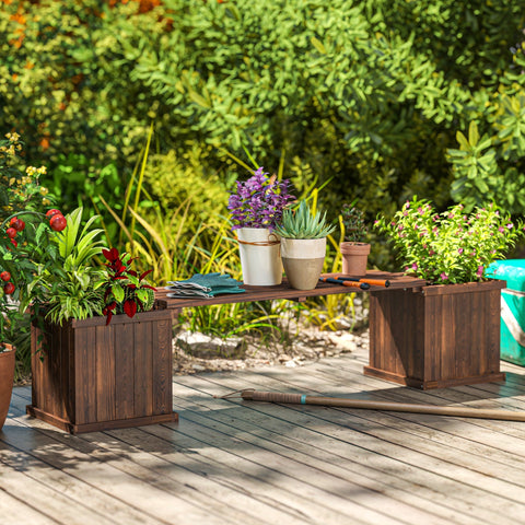 Dark brown wooden planter bench with vertical slats and carbonised finish designed to drain excess water efficiently