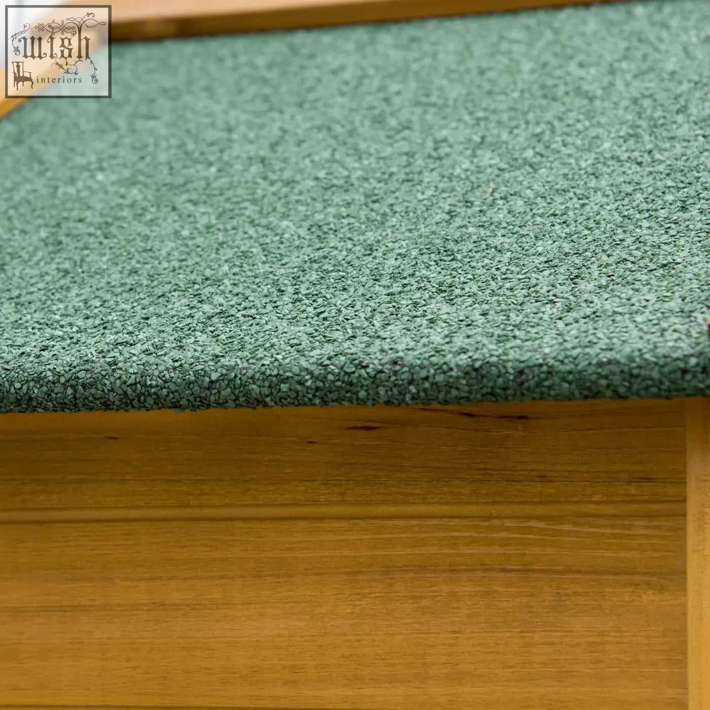 Green textured carpeted step with wooden frame in natural wood effect fir wood garden storage shed utility cabinet