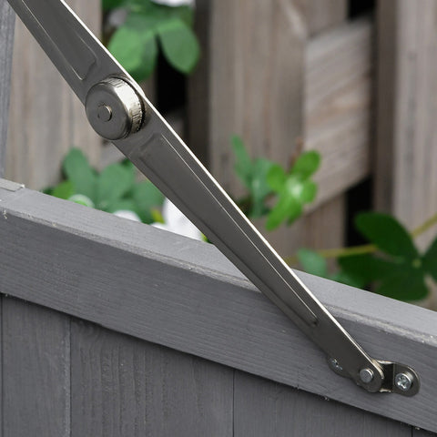 Silver metal door hinge with screws on the grey outsunny wooden garden storage shed for outdoor storage