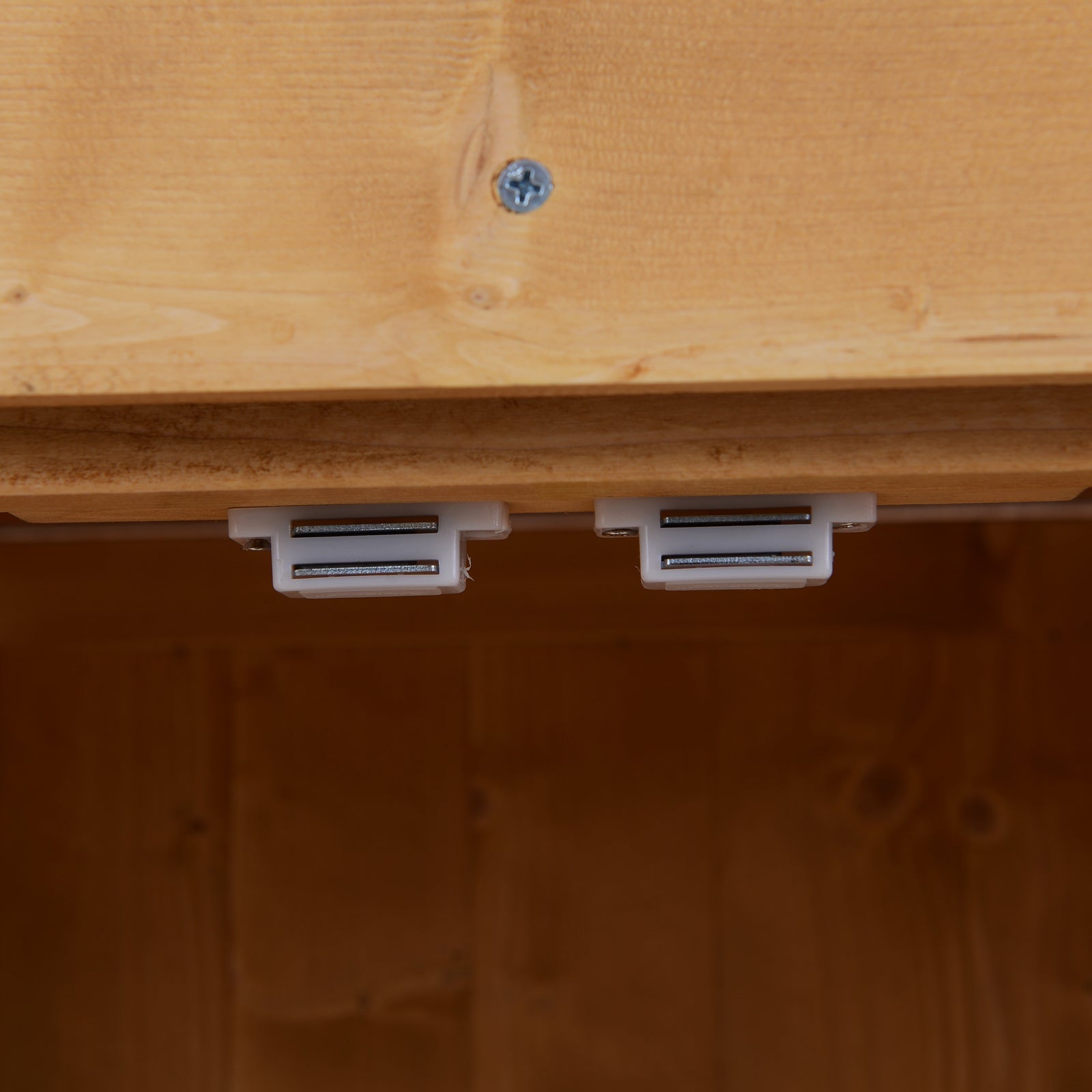 White plastic drawer runners with metal tracks installed under a burlywood outsunny wooden garden storage shed cabinet