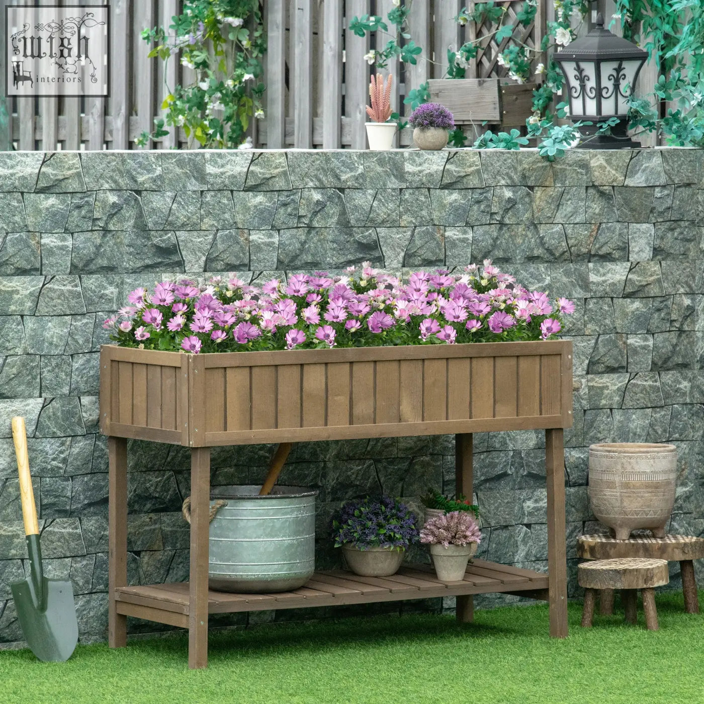 Brown fir wood raised garden bed with eight separate cubes 110l x 46w filled with vibrant purple flowers