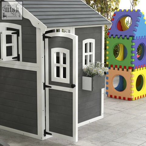 Gray and white outsunny wooden kids playhouse with arched door, inside flooring, windows, and a small plant box