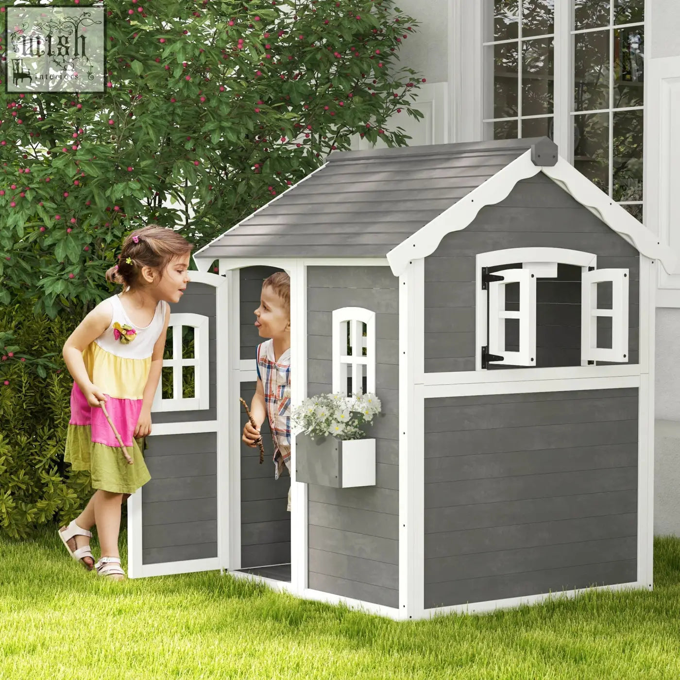Gray and white wooden kids playhouse with shingled roof, inside flooring, decorative windows, and attached plant box