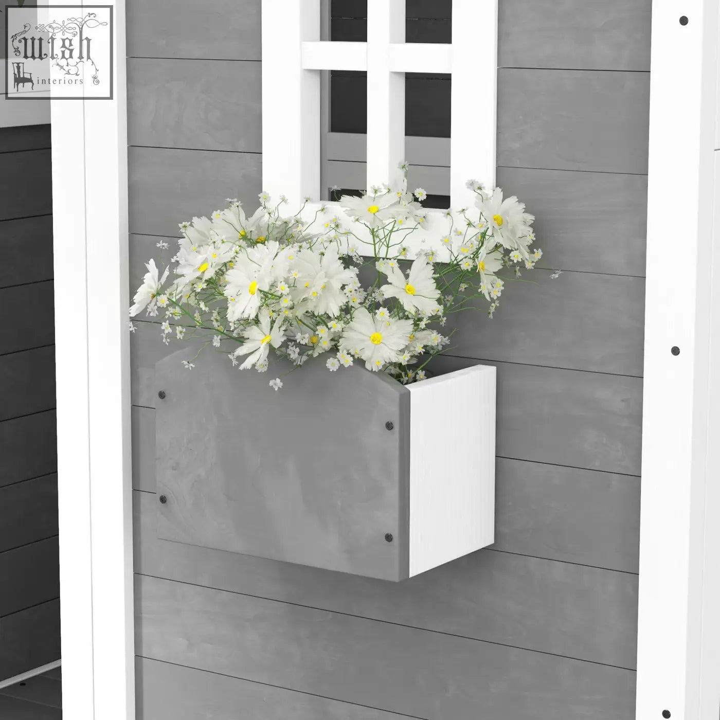 Grey wooden kids playhouse with white rectangular plant box filled with daisies and inside flooring for gardens