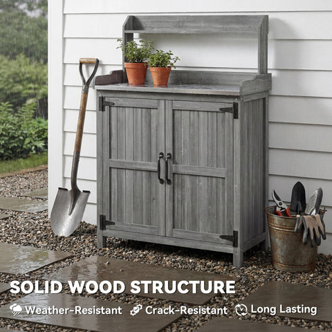 Gray wooden potting bench table with weathered finish black metal hardware and aluminium worktop for outdoor use