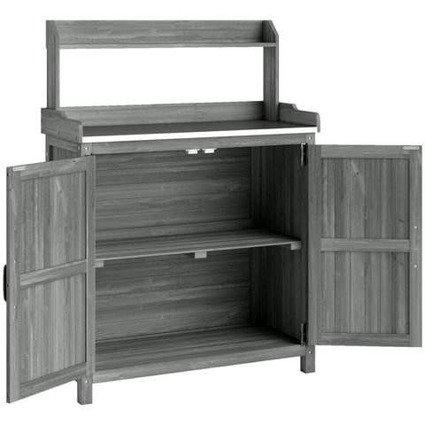 Gray wooden potting bench table with two open doors and top shelf outdoor garden workbench with water-based paint finish