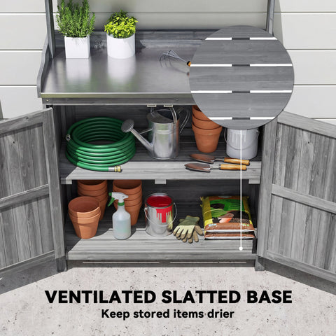 Gray wooden potting bench table with stainless steel top and ventilated base for outdoor garden use
