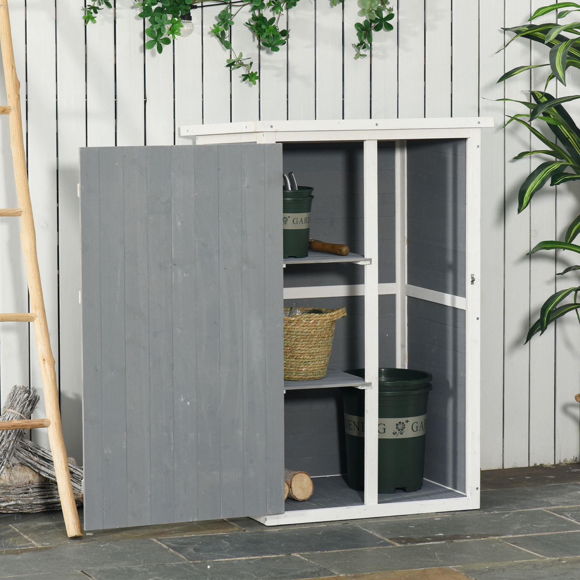 Gray and white wooden outsunny small shed with slatted door open showing garden tool storage shelves 75l x 56w cm