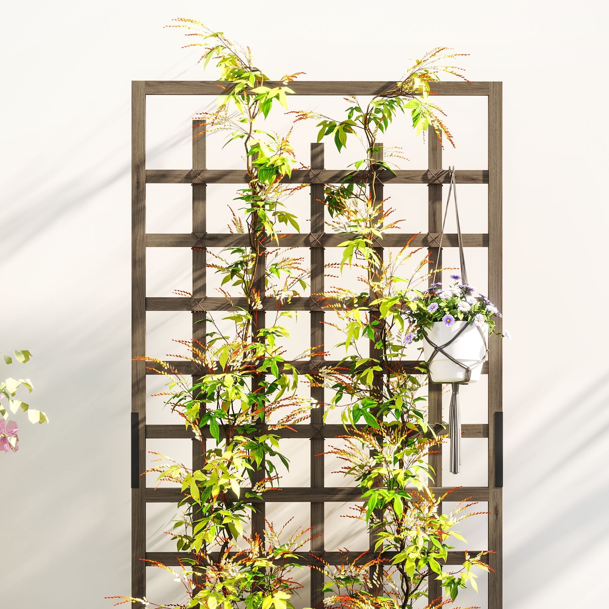 Dark brown wooden trellis with green vines and a hanging white macrame planter on outsunny raised garden bed