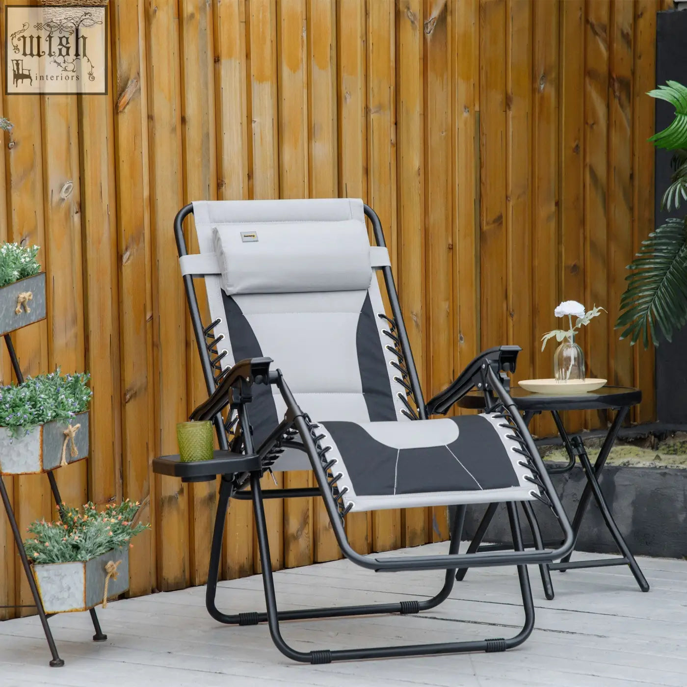 Black and light grey outsunny lounger chair with padded seat cup holder and side tables for poolside or camping