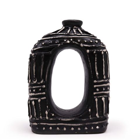 Black ceramic oval donut shaped vase with white geometric patterns and a central oval opening for dry flowers