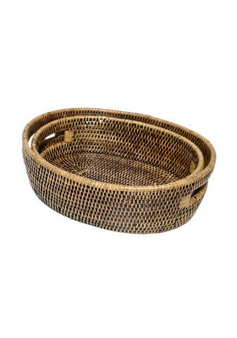 Set of three oval rattan baskets with woven texture and natural brown tones perfect for home decor and storage