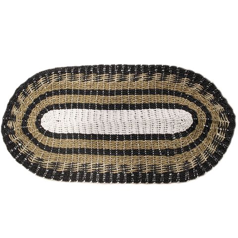 Oval woven seagrass rug with black white and tan concentric stripes perfect for classic home decor 60x120cm