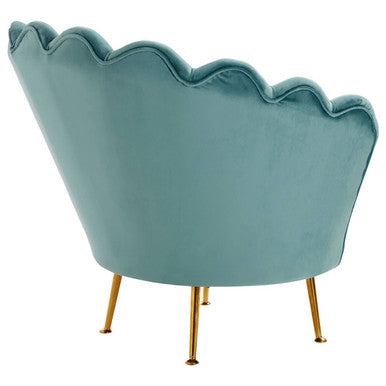 A teal velvet ovala blue scalloped chair with gold tone legs perfect for stylish living spaces