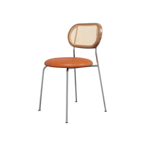 Modern ozzie rattan dining chair with woven cane back light wood frame orange seat and sleek chrome legs