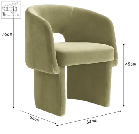 Olive green velvet paddy dining chair with curved modern design and solid base perfect for marble dining table setups