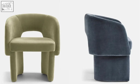 Olive green and navy blue velvet paddy dining chairs with rounded backs paired with a marble dining table in minimalist style