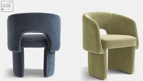 Two modern velvet paddy dining chairs in deep navy and olive green perfect for a marble dining table setup
