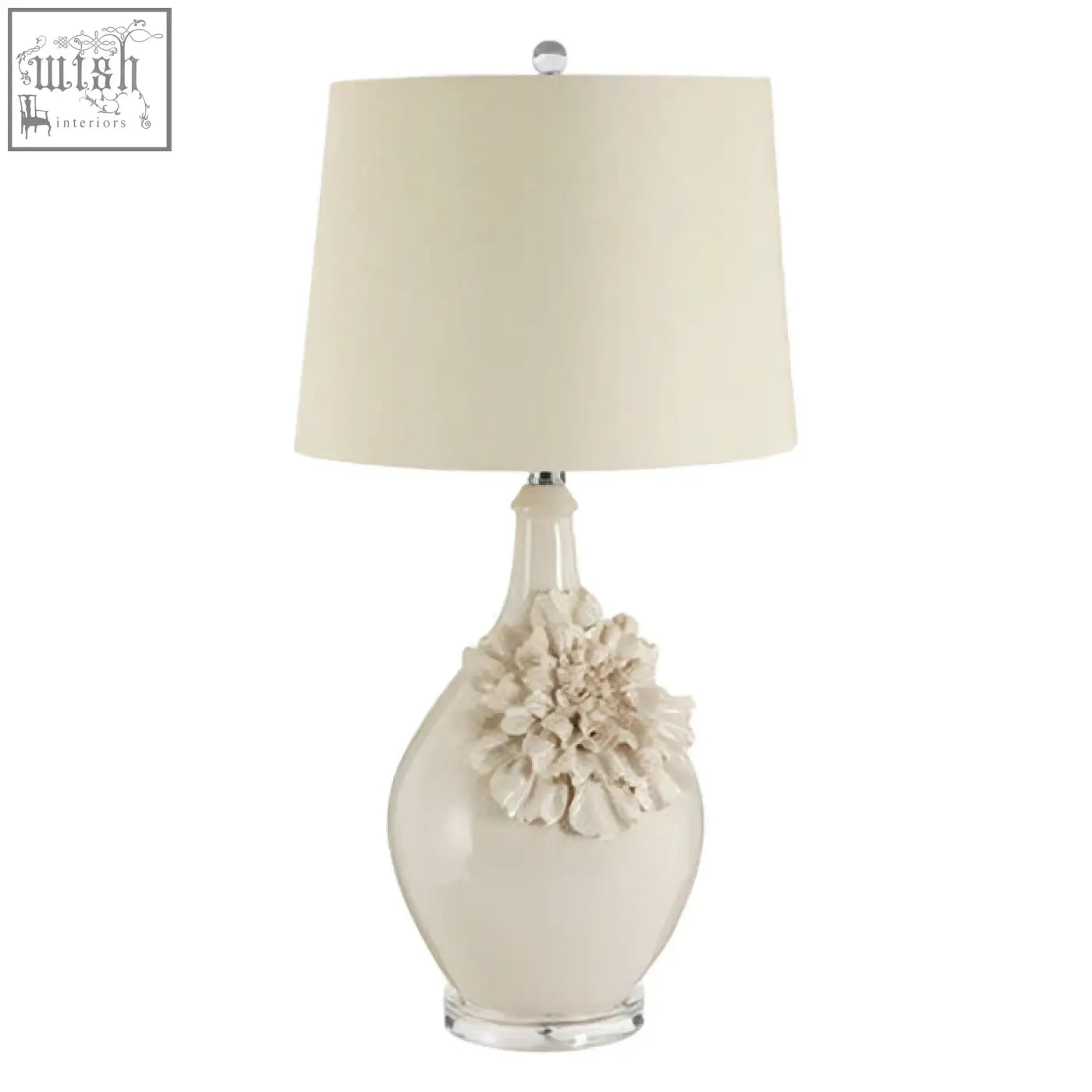 Cream-colored padma table lamp with sculpted floral accent and clear acrylic base for elegant lighting