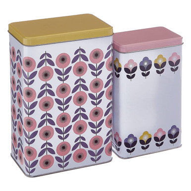Two metal storage canisters from the paice set featuring floral patterns with mustard yellow and dusty rose lids