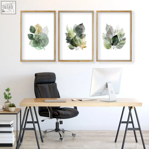 Set of three home office wall art prints with botanical watercolor leaves in muted green and gold in light wood frames