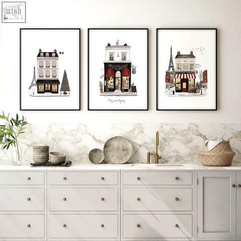 Three black framed parisian-themed wall art paintings featuring street scenes and the eiffel tower pour toujours