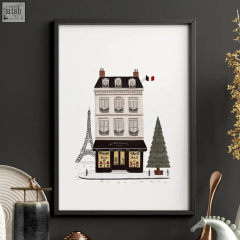 Black-framed wall art illustration of parisian café with white façade and eiffel tower in background street scenes pour toujours