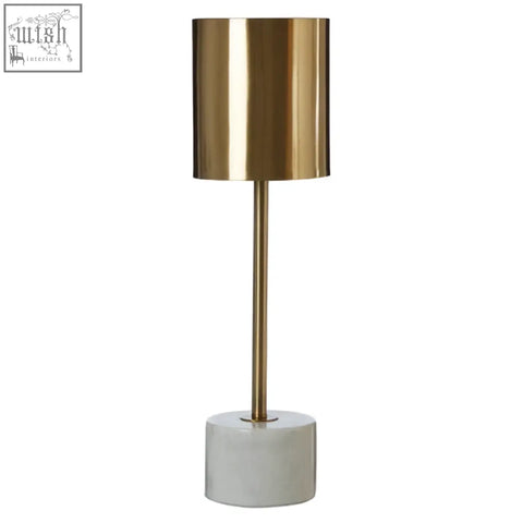 Gold palais table lamp with sleek metallic finish and white marble base featuring a marble base design