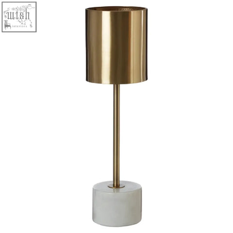 Gold-toned palais table lamp with sleek cylindrical design and white marble base for stylish lighting