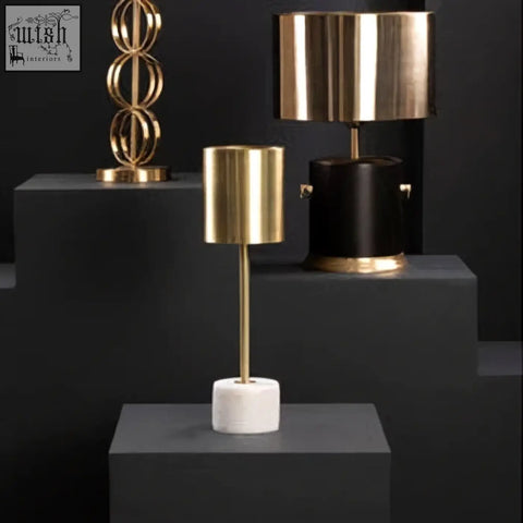 Palais table lamp with gold-toned cylinder and white marble base perfect for elegant lighting decor
