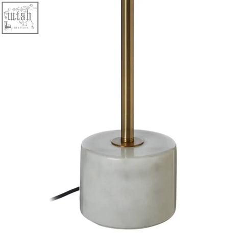 Palais table lamp with a sleek white marble base and polished gold toned metal stem for elegant lighting