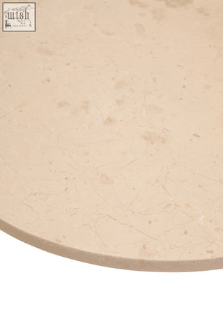 Beige cream marble top with subtle veining and polished finish on palermo round cream marble small coffee table