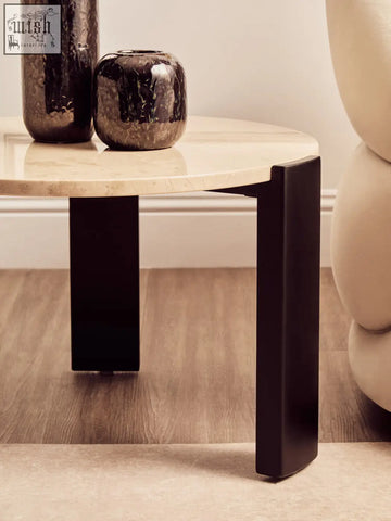 Modern side table with round cream marble top and sleek black metal legs perfect as a small coffee table
