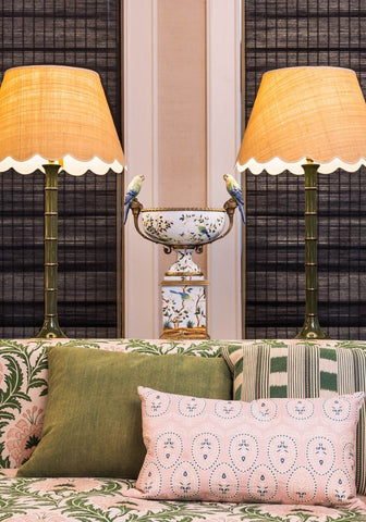 A palm beach cushion cover featuring a decorative white porcelain urn with blue floral and bird motifs and parrots